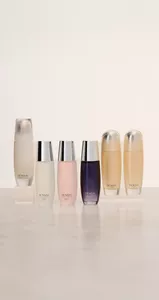 Group of Sensai Step 1 lotions next to each other on top of light gray glossy surface